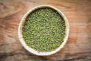 Mung beans or Green beans seed cereal whole grains on bamboo threshing basket photo