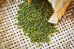 Mung beans or Green beans seed cereal whole grains on bamboo threshing basket photo