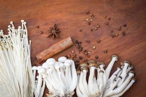 Enoki or Golden Needle Mushroom and Shimeji Mushroom with herbs and spices photo