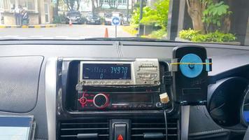 Taxi meter and dashboard interior. View from backseats. photo