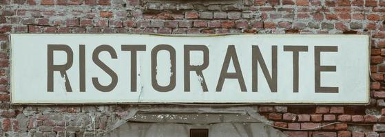 Old Restaurant sign in Italy photo