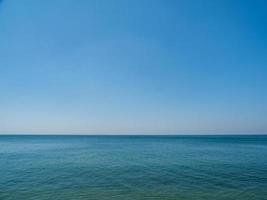 Panorama front view landscape Blue sea and sky blue background morning day look calm summer Nature tropical sea Beautiful  ocen water travel Bangsaen Beach East thailand Chonburi Exotic horizon. photo
