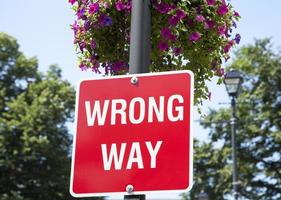 Wrong Way Sign With Flowers In Halifax photo
