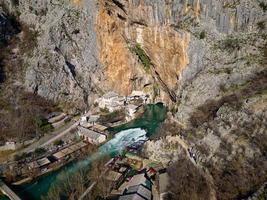 Aerial drone view of Tekija in Blagaj in BiH. The Tekija, dervish house, set at the source of the river Buna, was and still is a venue for dervish Zikr praise-chanting three nights weekly. photo