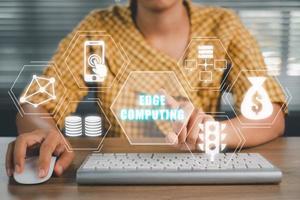 Edge computing concept, Person using computer on office desk with Edge computing  icon on virtual screen, modern IT technology, internet and networking concept. photo