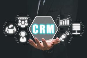 CRM Customer Relationship Management Business Internet Techology Concept, Man hand holding customer Relationship Management icon on VR creen. photo