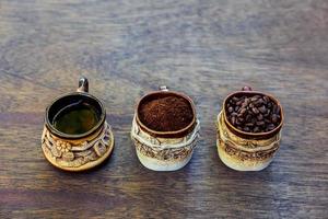 Coffee cup, beans and ground photo