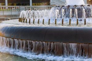 Water fountain on the city square photo