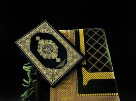 Man Holding and reading quran. Islamic Background photo