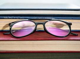 Close up Eye glasses and books photo