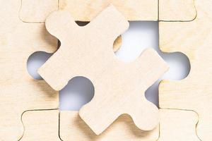 Blank wooden jigsaw puzzle photo