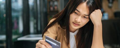 Young businesswoman paying order having contactless payment with cardit card photo