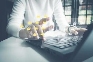 Officer using laptop manage files, Document Management System DMS, Online document database management, automated processes to manage system, ERP enterprise efficient, business technology. photo