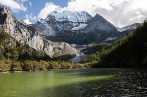 Majestic snow mountain under clouds photo