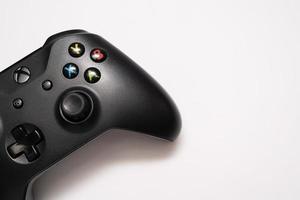 Samutprakarn Thailand Jan 23 2023 Wireless gamepad for the Xbox One on desk with keyboard. Black Xbox game controller. photo