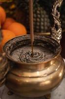 Bandung, Indonesia, 2020 - The offerings like food and candle on the top of the red Buddhist table during the praying from the monks photo