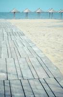 Wooden walkway to water seascape photo