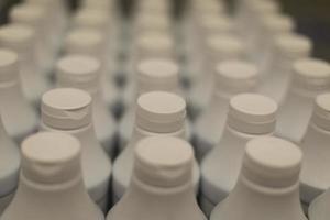White bottles. Yogurt bottles. Drinks in store. photo
