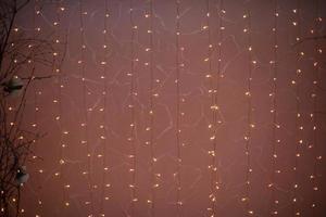 Red garlands. Small light bulbs. LED string lights. photo