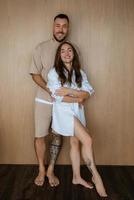 earlier morning the bride and groom at home in the kitchen photo