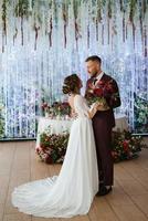 portrait of a young couple of newlyweds in wedding looks photo