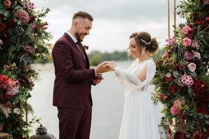 wedding ceremony of the newlyweds on the pier photo