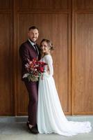 portrait of a young couple of newlyweds in wedding looks photo