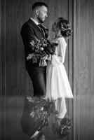 portrait of a young couple of newlyweds in wedding looks photo