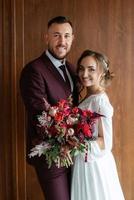 portrait of a young couple of newlyweds in wedding looks photo