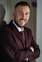 portrait of smiling groom with beard photo