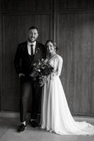 portrait of a young couple of newlyweds in wedding looks photo