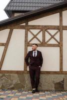 portrait of smiling groom with beard photo