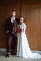 portrait of a young couple of newlyweds in wedding looks photo