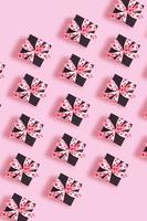 Valentines Day background with pattern from present gift box with bow top view photo