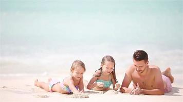 Father and kids enjoying beach summer tropical vacation video