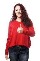 young woman giving thumbs up photo