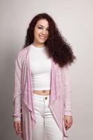 fashionable teenage girl with curly hair photo