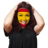 girl with spanish flag face paint photo