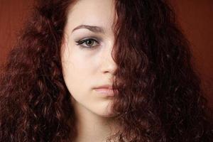 sullen girl with natural curly hair photo