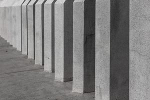 The arched concrete pillars are neatly arranged and of the same color. photo