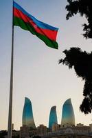 the flag of Azerbaijan , against the background of the city 's attractions photo