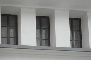 teak windows in old building photo