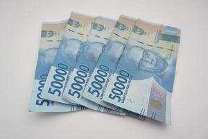 Batam, Indonesia, October, 2022,  indonesian rupiah money on white background photo