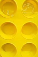Yellow silicone cupcake mold. Selling kitchen tools in  store. Kitchen utensils for cooking. photo