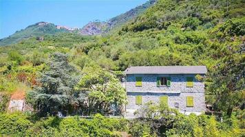 View of one old building against a majestic mountain landscape and italian vineyards in Cinque Terre video