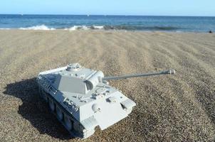 Toy tank at the beach