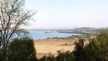 Beautiful view of beach around Bolsena lake photo