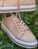 fragment of beige leather women's shoes photo