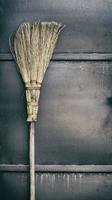 old broom on a wooden handle photo