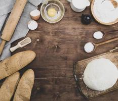 kneaded dough and ingredients for making bread photo